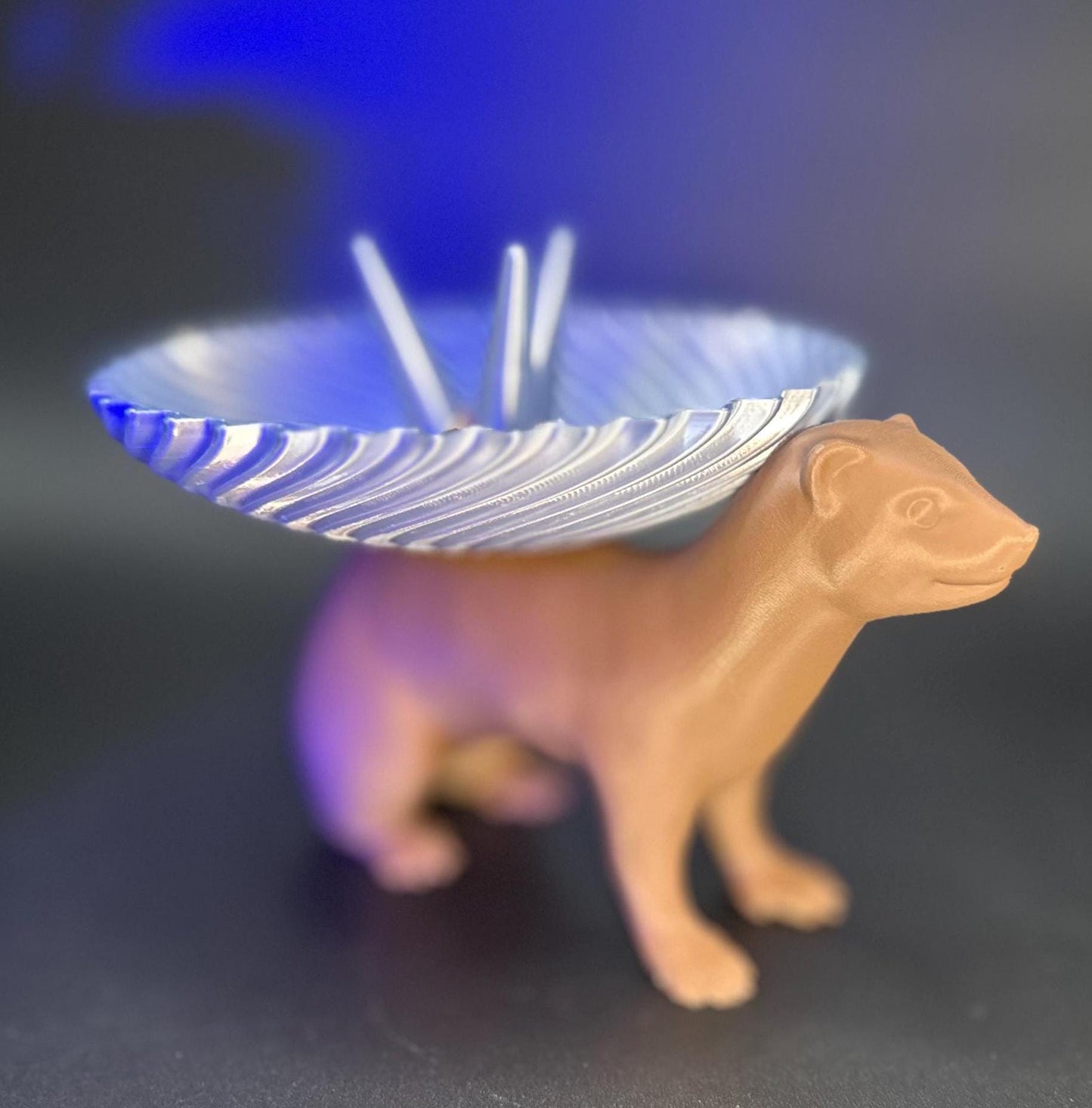 Adorable ferret figurine with a decorative dish on its back for holding rings, necklaces, and accessories. A unique jewelry organizer.