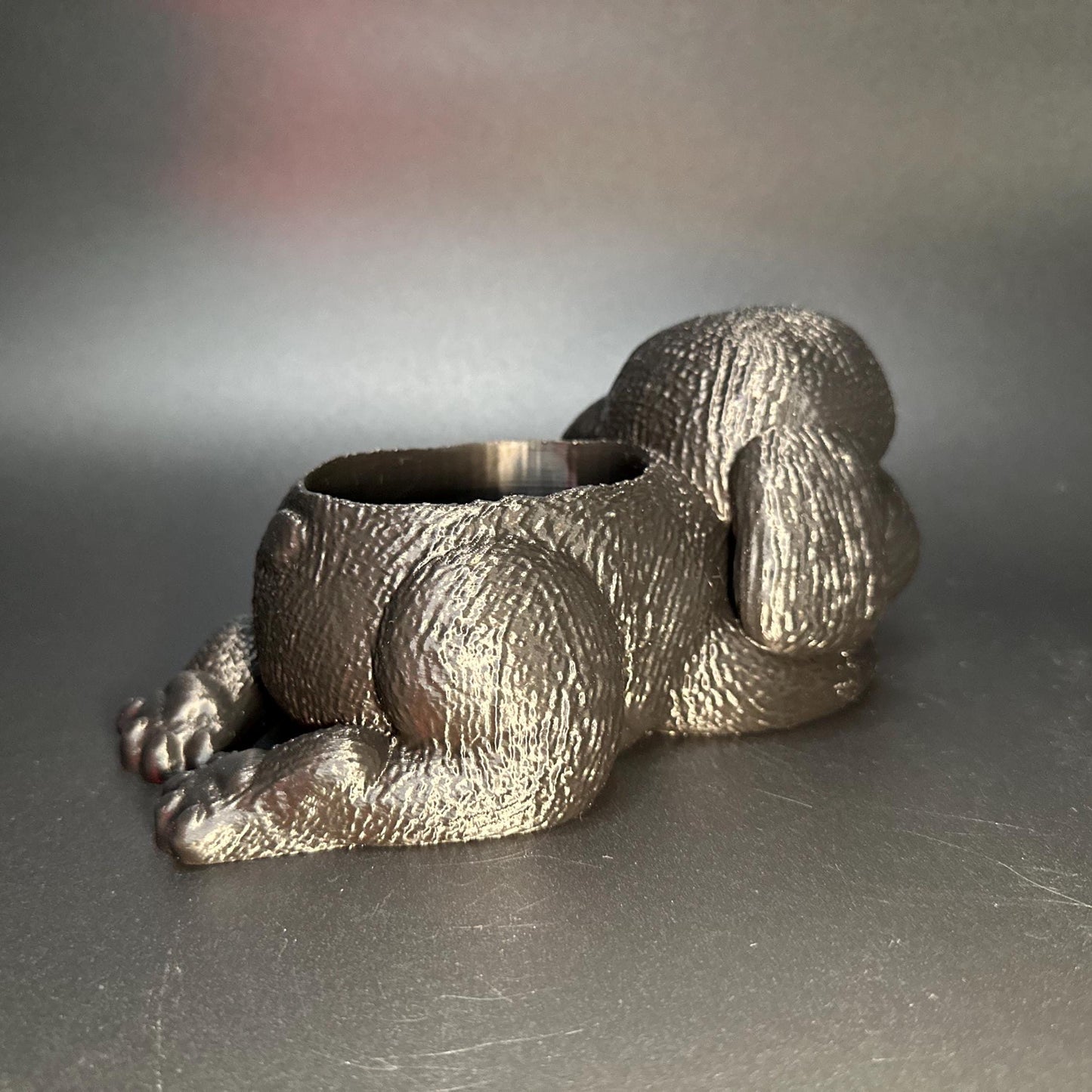 Cute 3D-printed poodle planter for succulents or small plants. Available in six colors: black, chocolate brown, beige, white, gray, and marble.