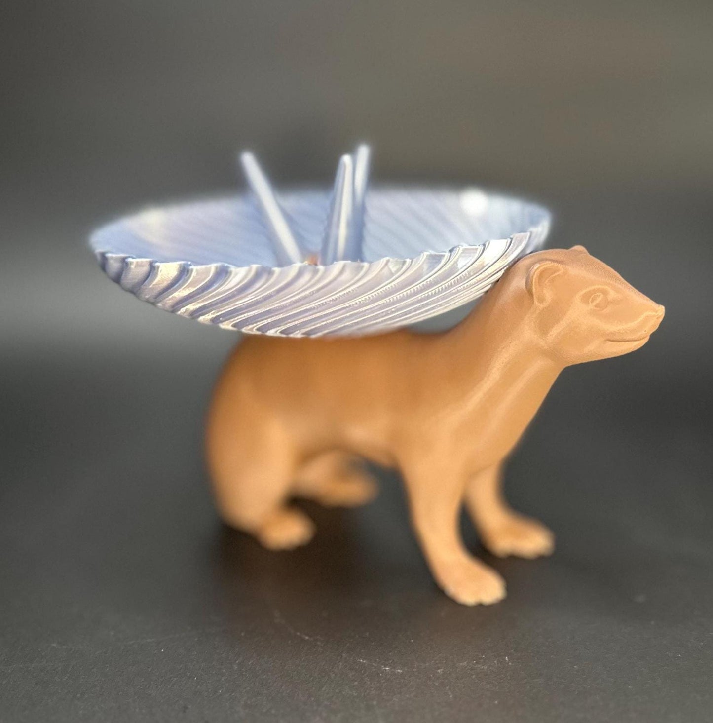 Adorable ferret figurine with a decorative dish on its back for holding rings, necklaces, and accessories. A unique jewelry organizer.
