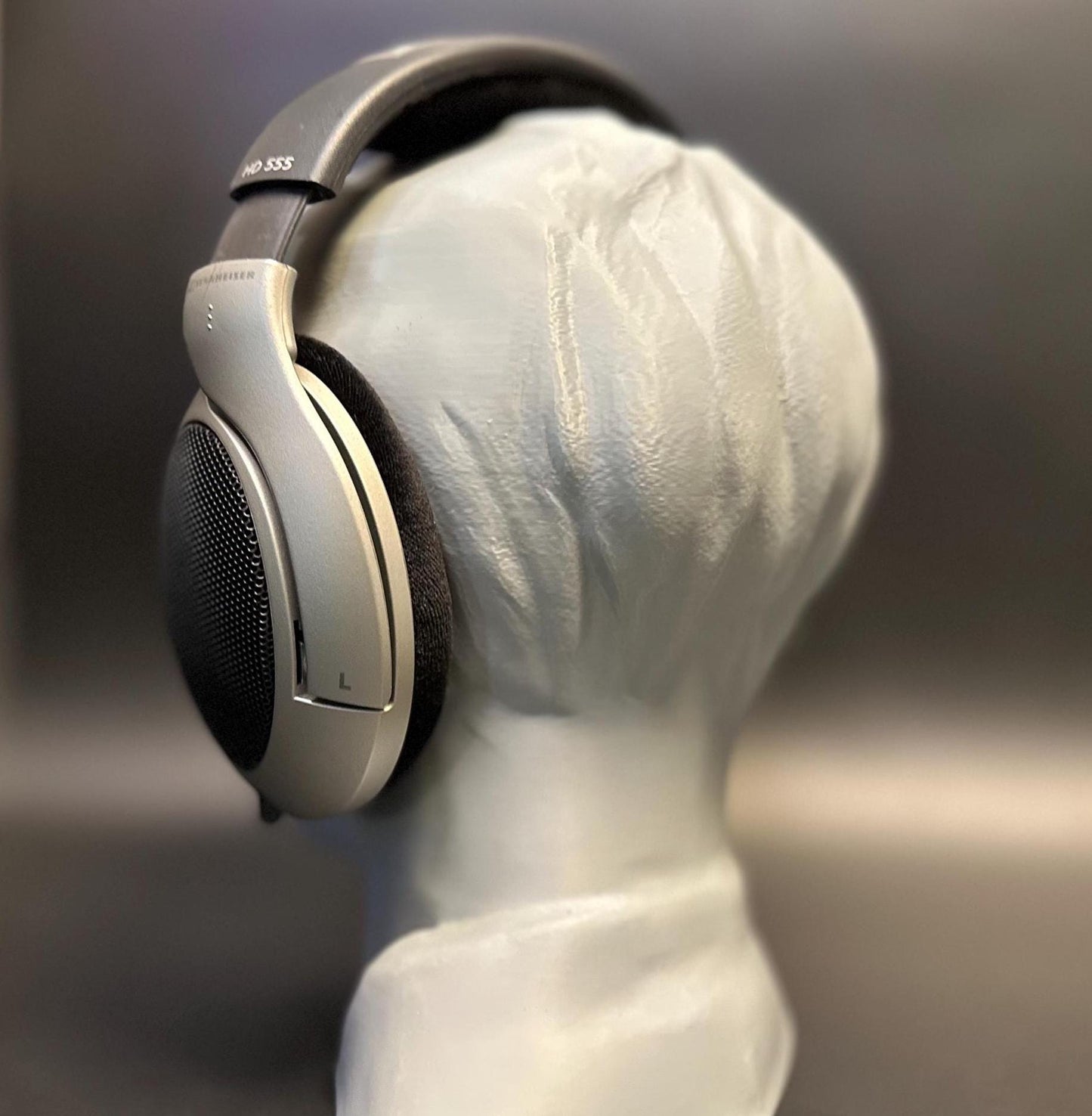A meticulously crafted headphone stand inspired by Bang Chan. Available in various colors, including metallic finishes, showcasing sleek details and a premium design for Stray Kids fans and audiophiles alike.