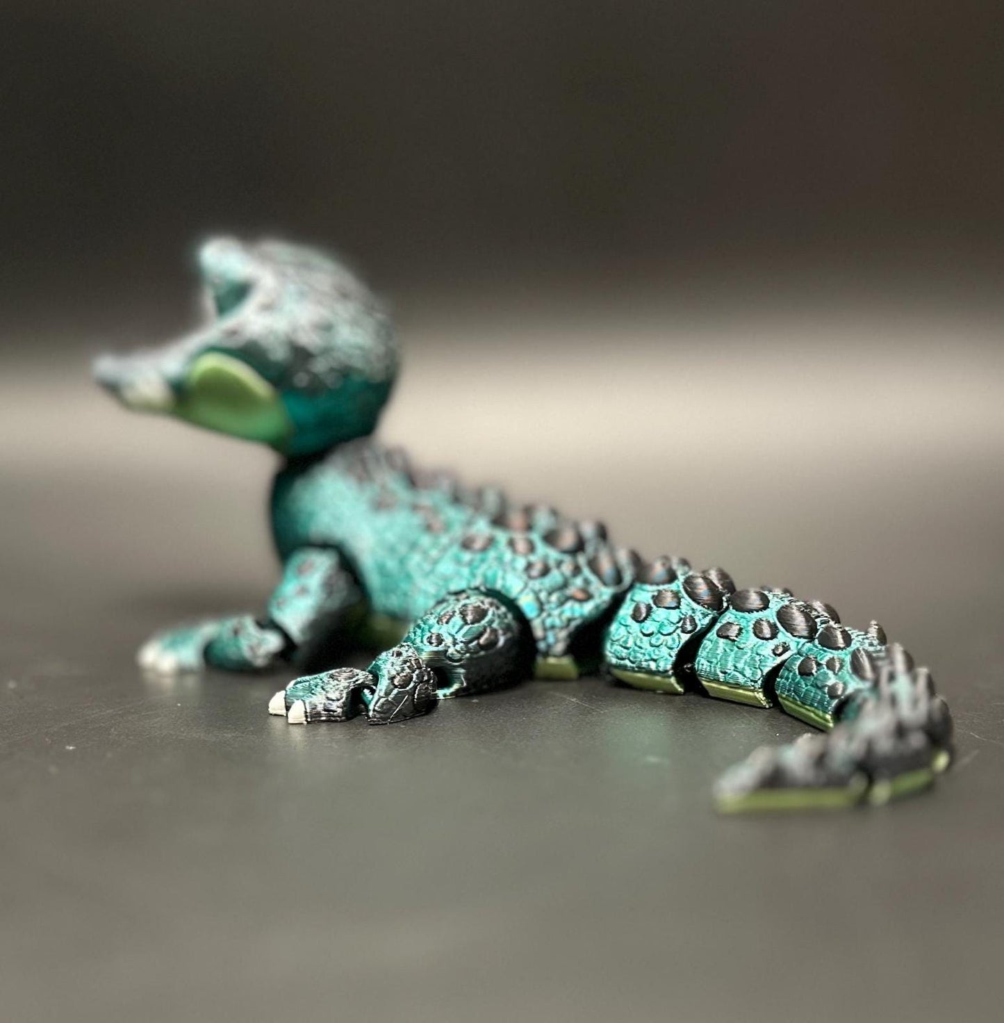 A posable, 3D-printed crocodile figurine with moving legs, tail, and mouth. A fun collectible or desk toy for animal lovers.
