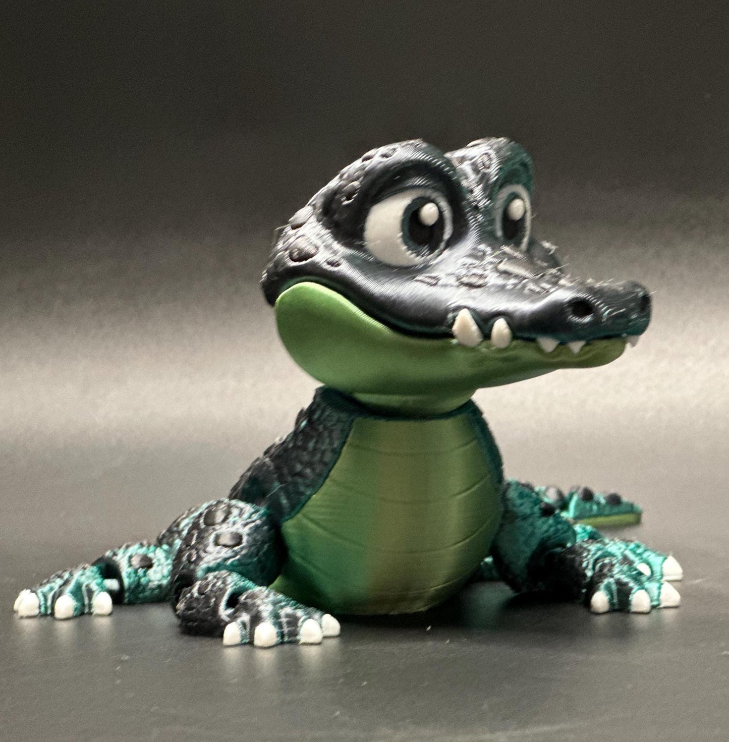 A posable, 3D-printed crocodile figurine with moving legs, tail, and mouth. A fun collectible or desk toy for animal lovers.