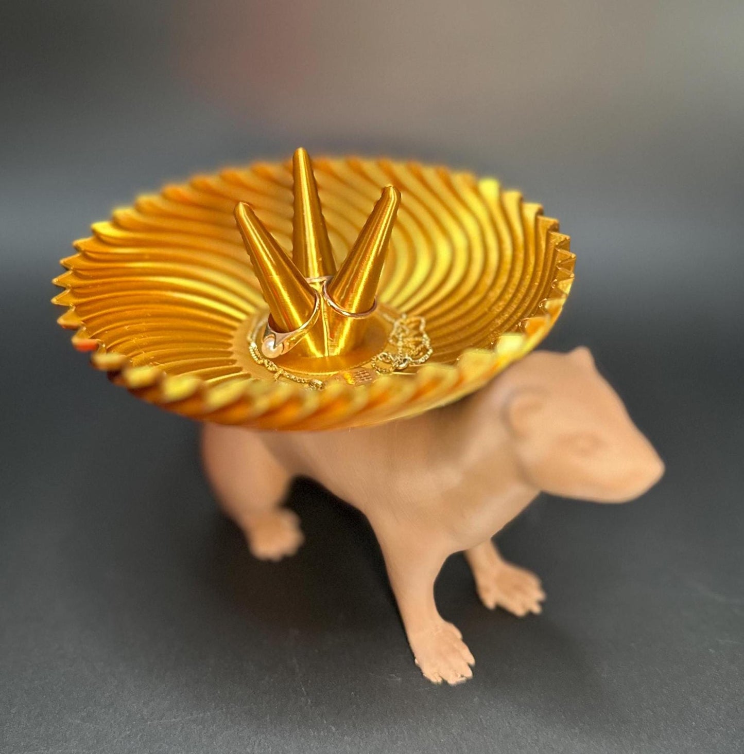 Adorable ferret figurine with a decorative dish on its back for holding rings, necklaces, and accessories. A unique jewelry organizer.