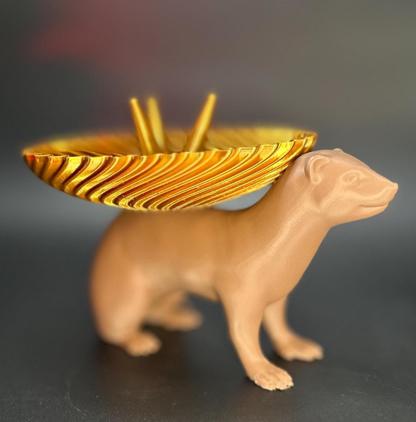 Adorable ferret figurine with a decorative dish on its back for holding rings, necklaces, and accessories. A unique jewelry organizer.