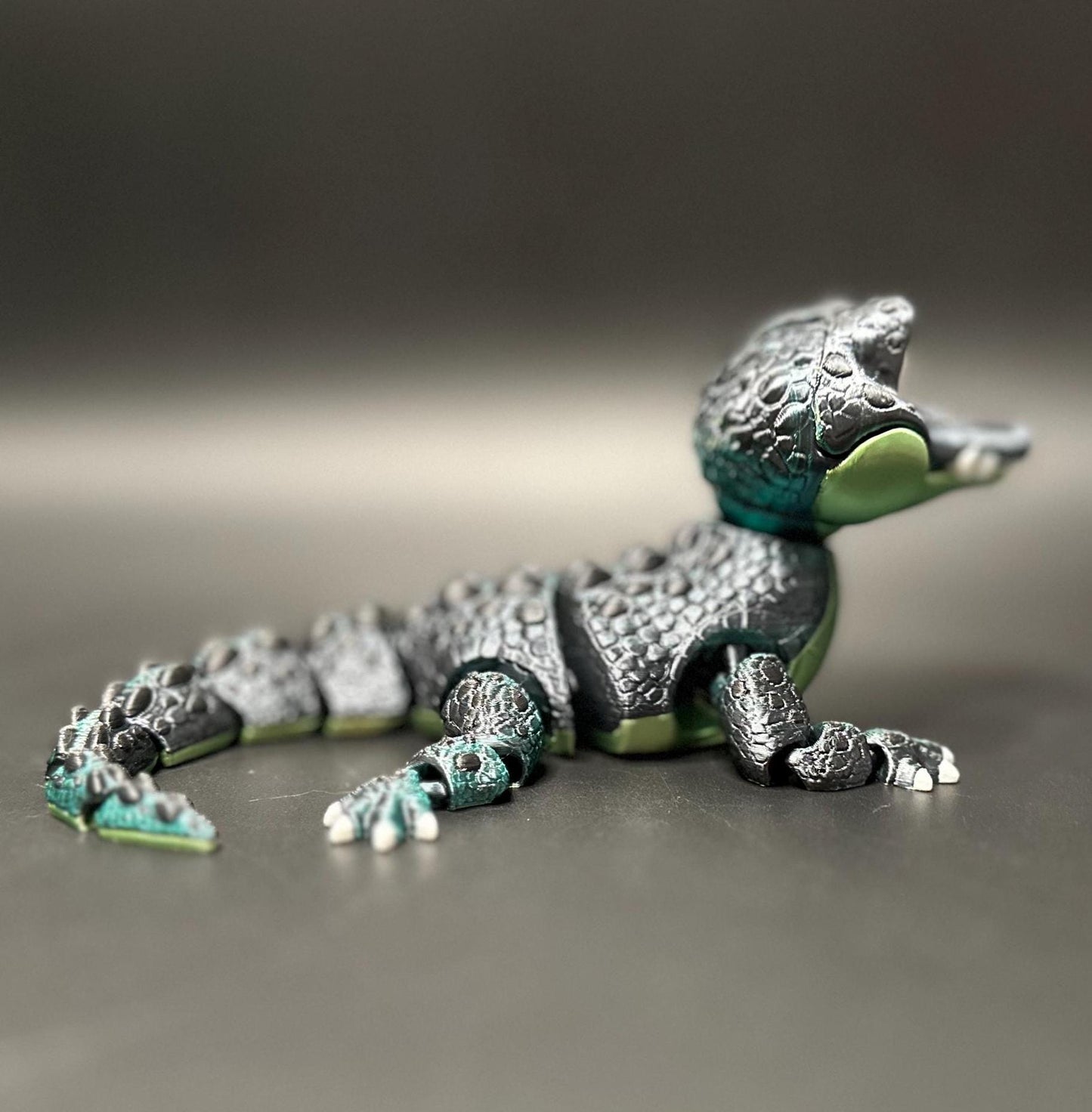 A posable, 3D-printed crocodile figurine with moving legs, tail, and mouth. A fun collectible or desk toy for animal lovers.