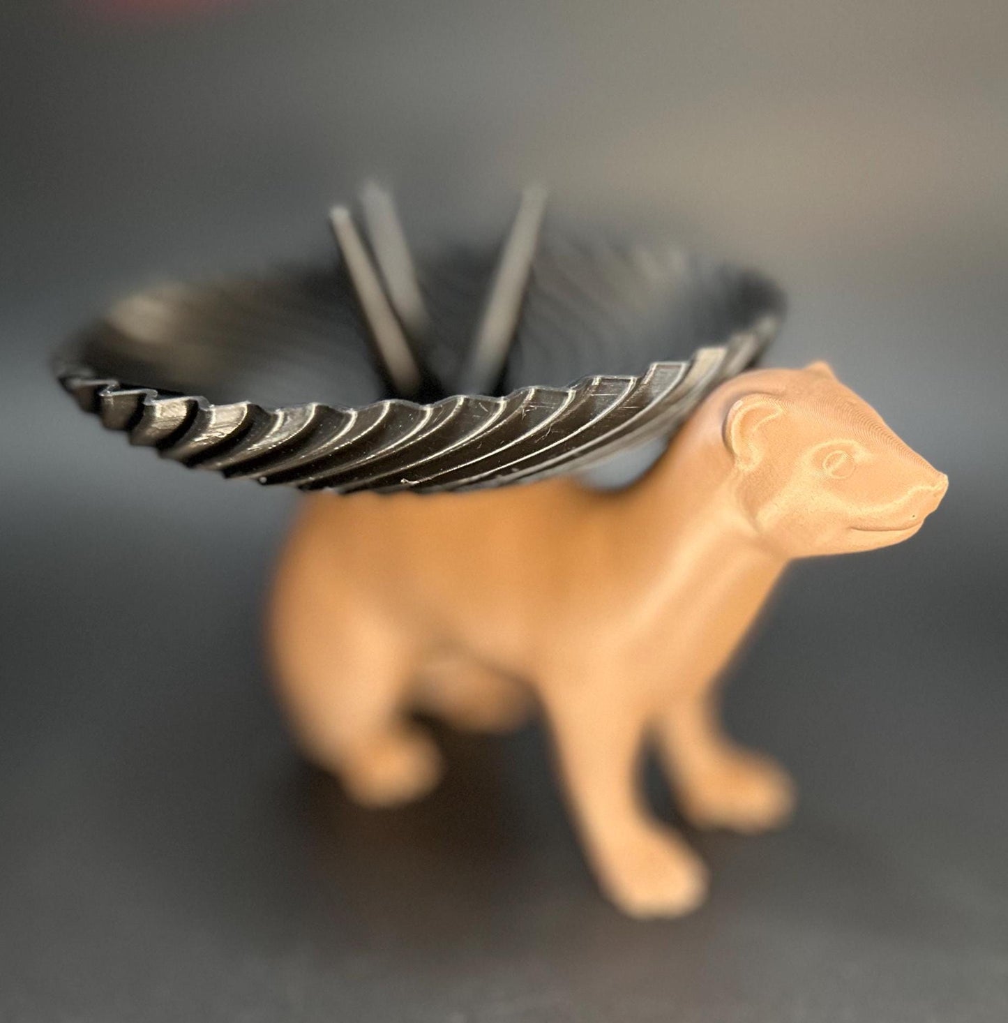 Adorable ferret figurine with a decorative dish on its back for holding rings, necklaces, and accessories. A unique jewelry organizer.