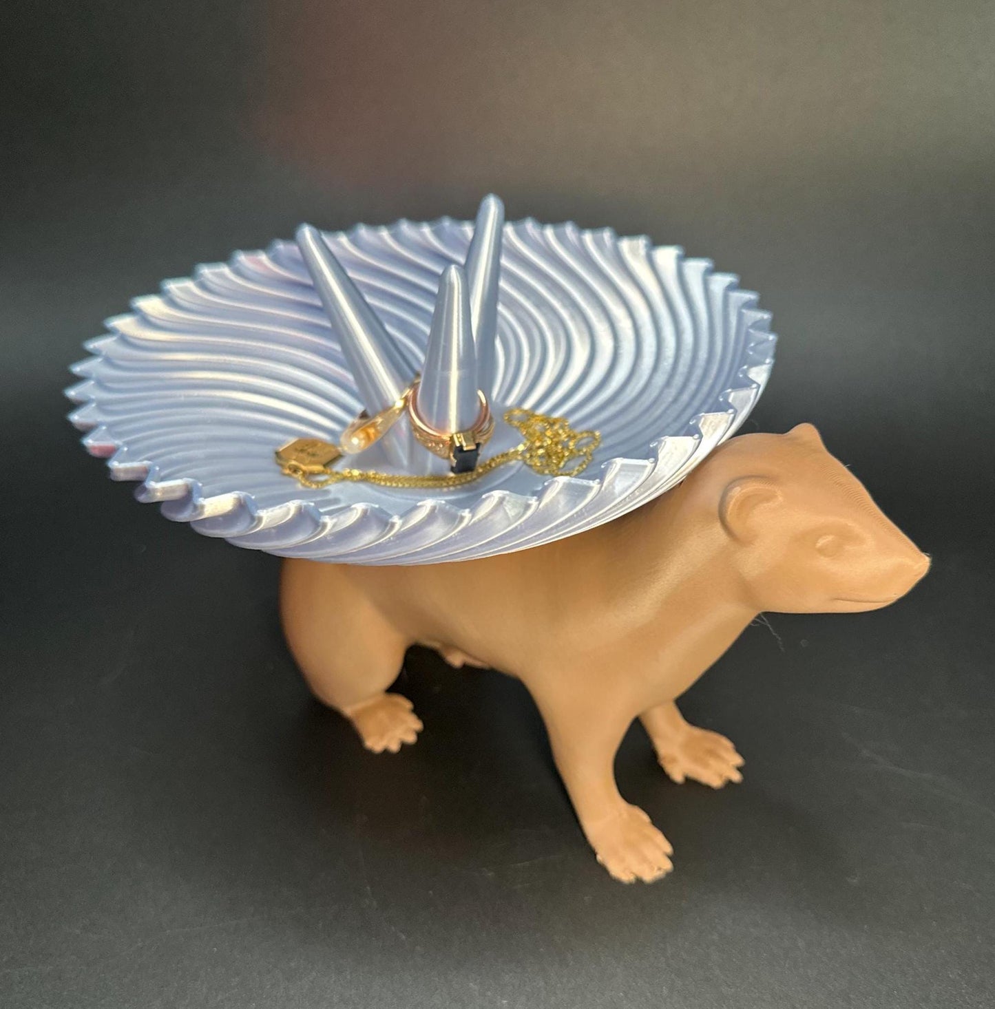 Adorable ferret figurine with a decorative dish on its back for holding rings, necklaces, and accessories. A unique jewelry organizer.
