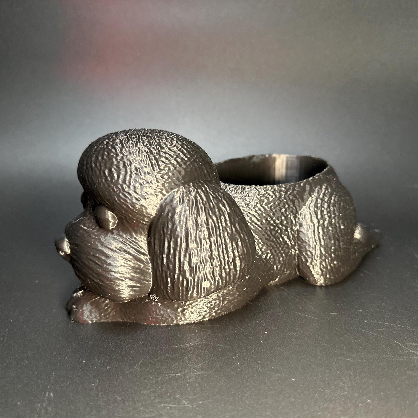 Cute 3D-printed poodle planter for succulents or small plants. Available in six colors: black, chocolate brown, beige, white, gray, and marble.
