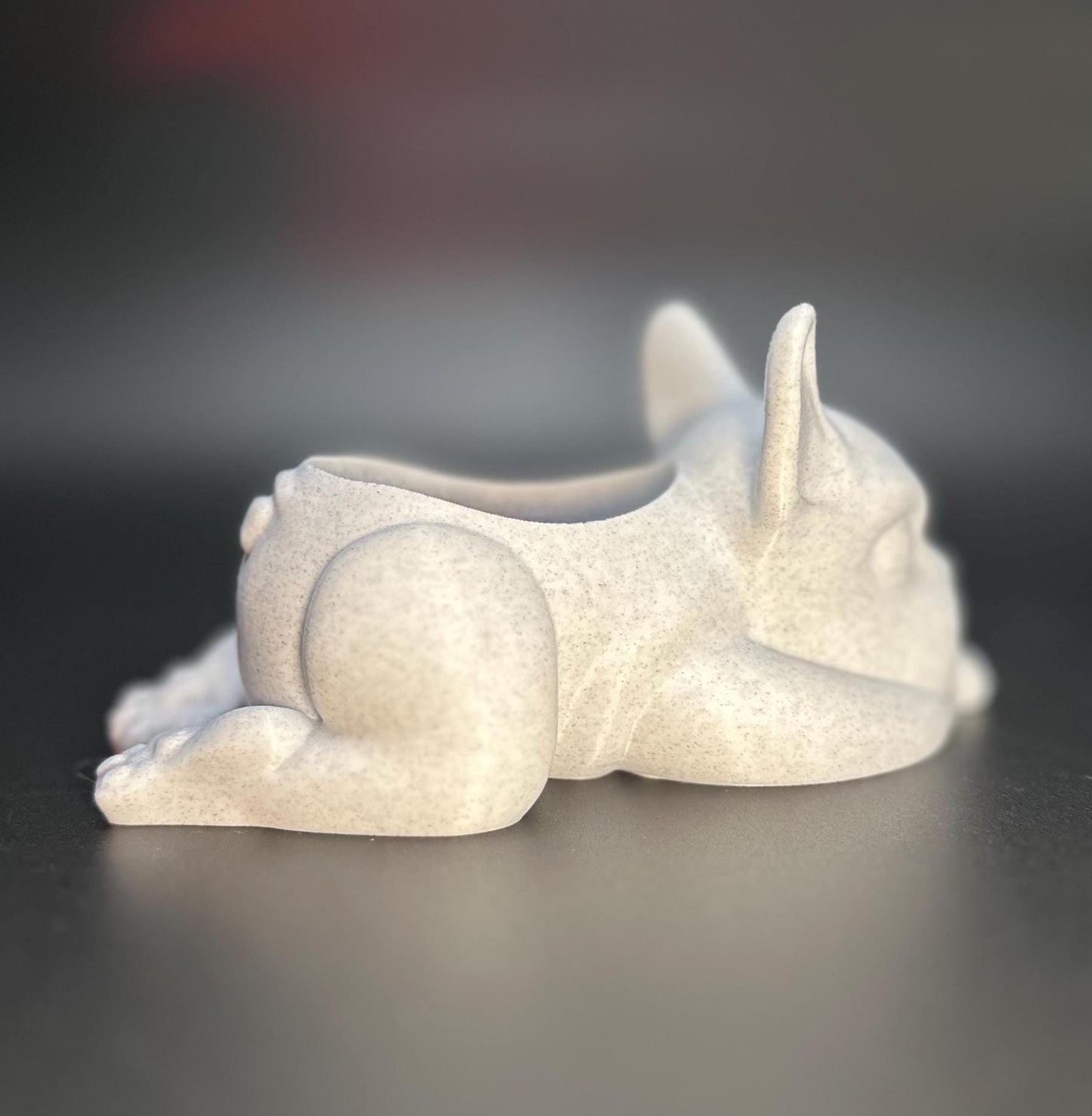 3D-printed French Bulldog planter for succulents or small plants. Available in black, chocolate brown, beige, white, gray, and marble colors.