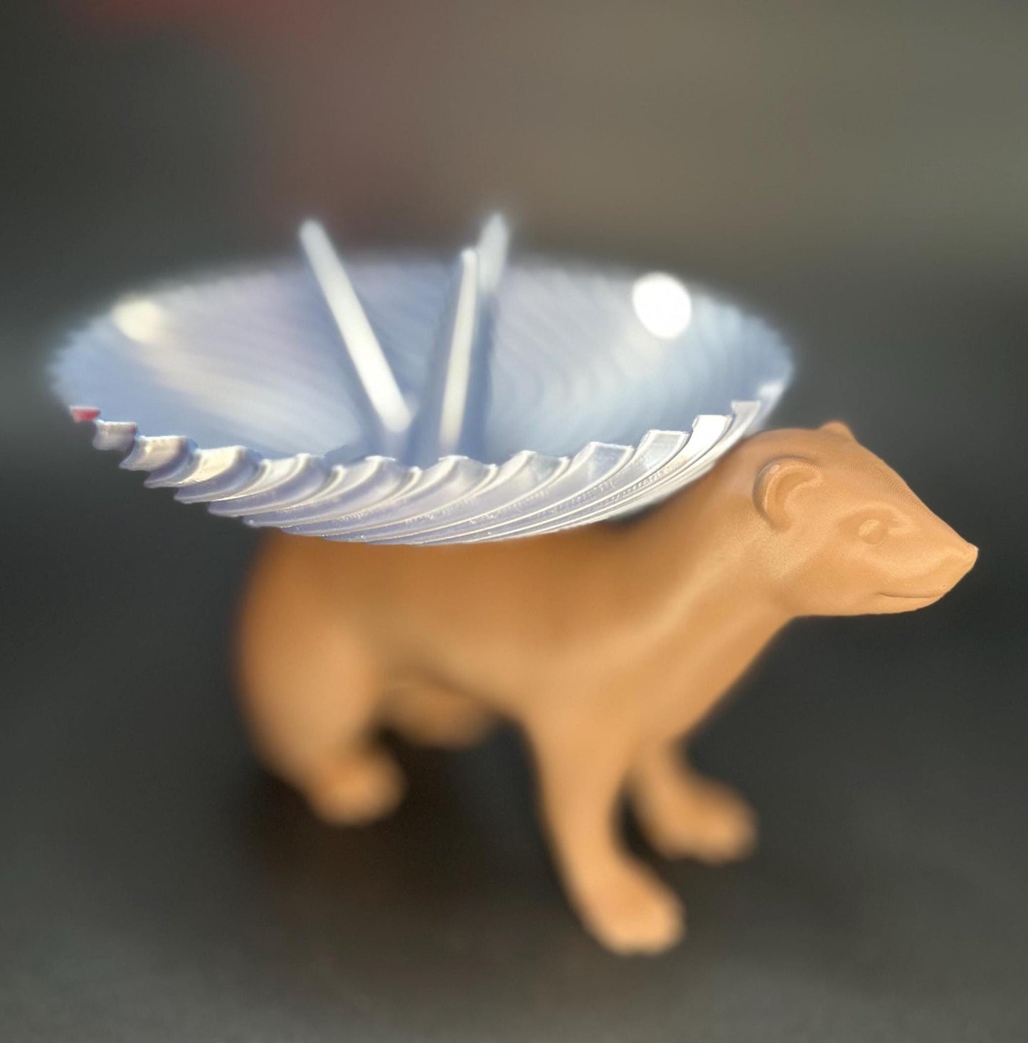 Adorable ferret figurine with a decorative dish on its back for holding rings, necklaces, and accessories. A unique jewelry organizer.