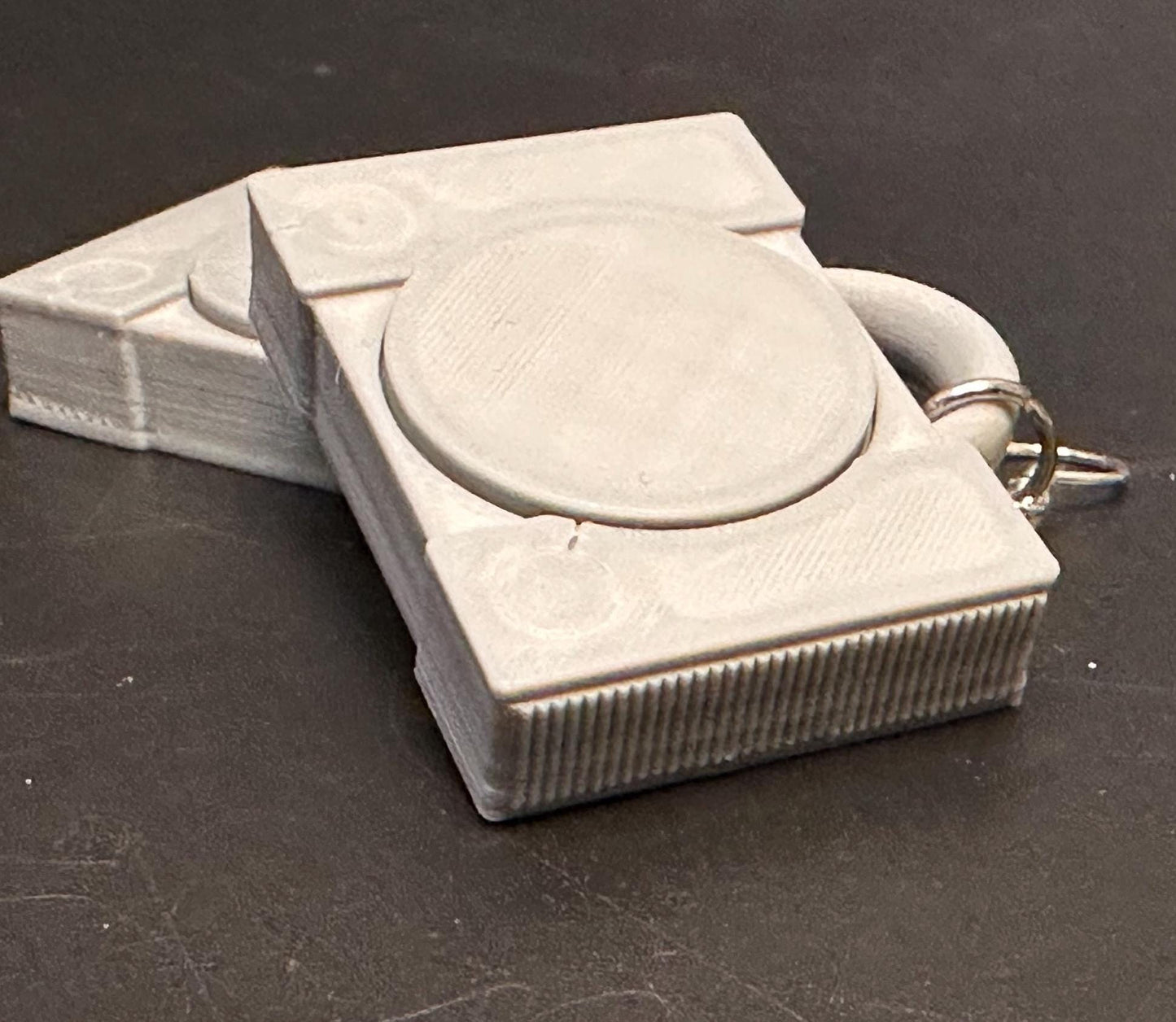 PS1 console-inspired earrings with a sleek retro design, celebrating gaming nostalgia. Lightweight and perfect for gamers and vintage enthusiasts.