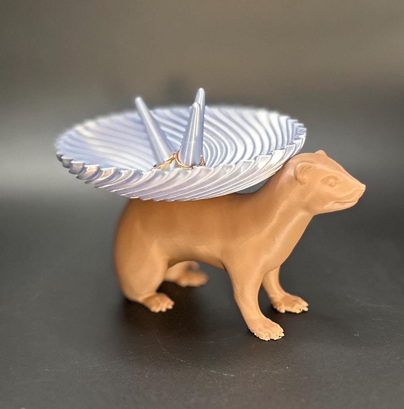 Adorable ferret figurine with a decorative dish on its back for holding rings, necklaces, and accessories. A unique jewelry organizer.