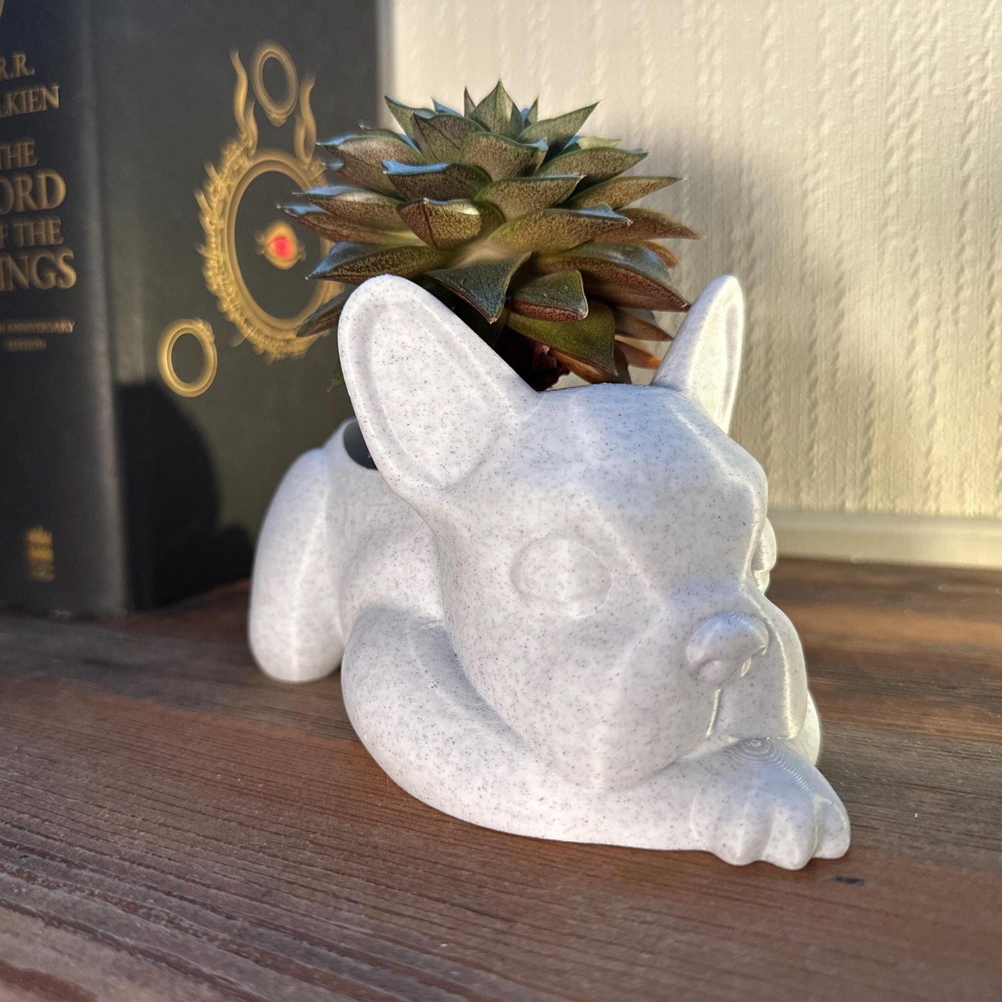 3D-printed French Bulldog planter for succulents or small plants. Available in black, chocolate brown, beige, white, gray, and marble colors.