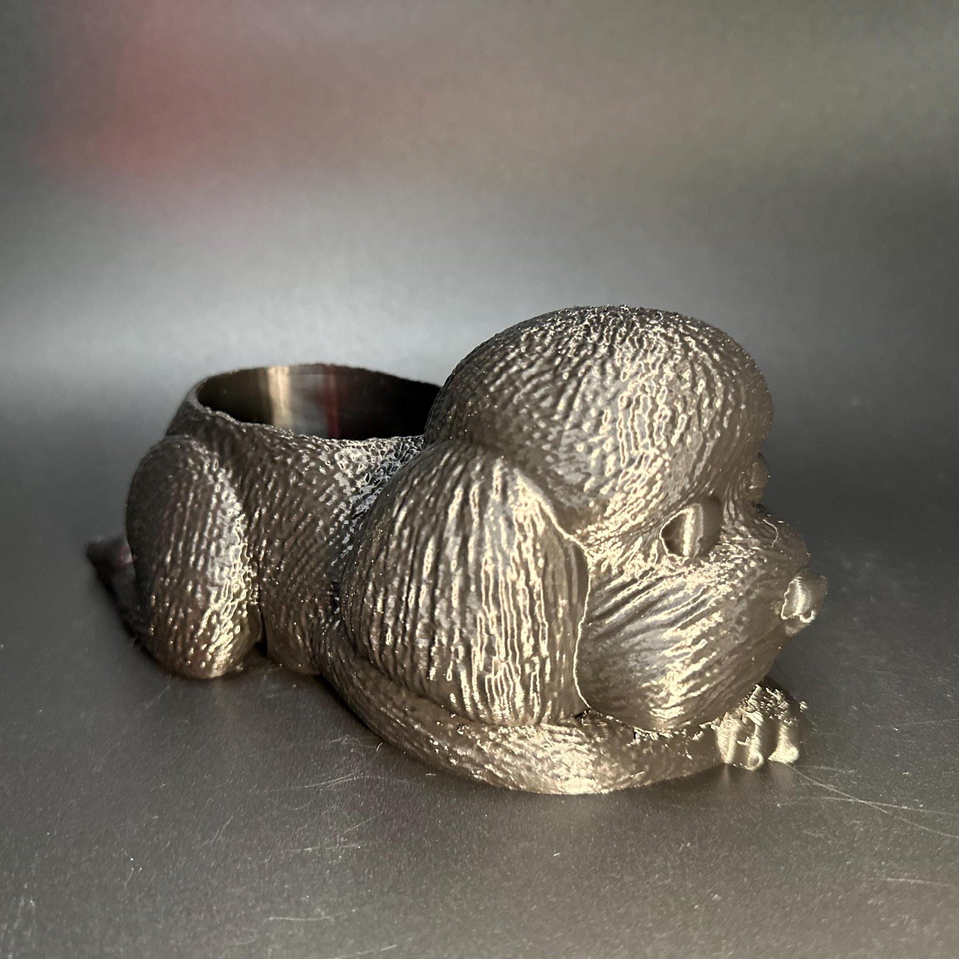 Cute 3D-printed poodle planter for succulents or small plants. Available in six colors: black, chocolate brown, beige, white, gray, and marble.
