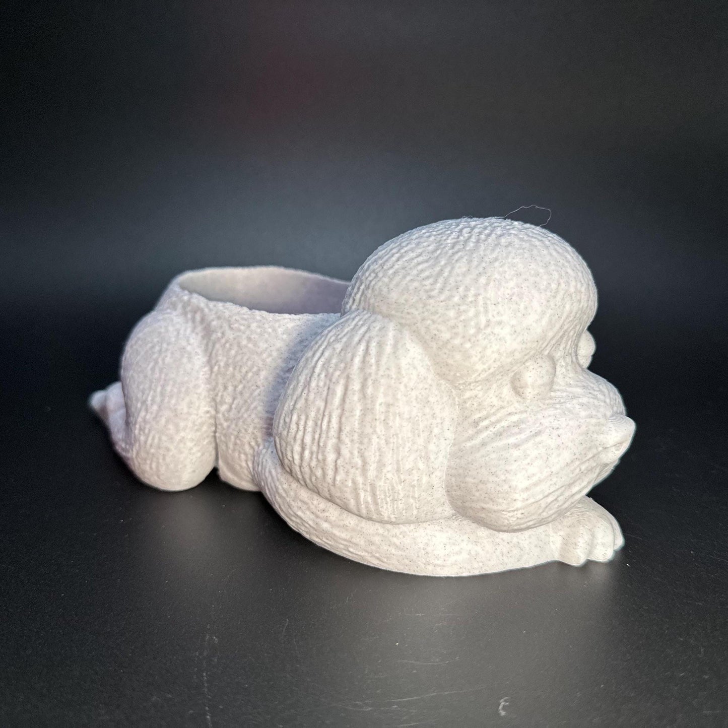 Cute 3D-printed poodle planter for succulents or small plants. Available in six colors: black, chocolate brown, beige, white, gray, and marble.