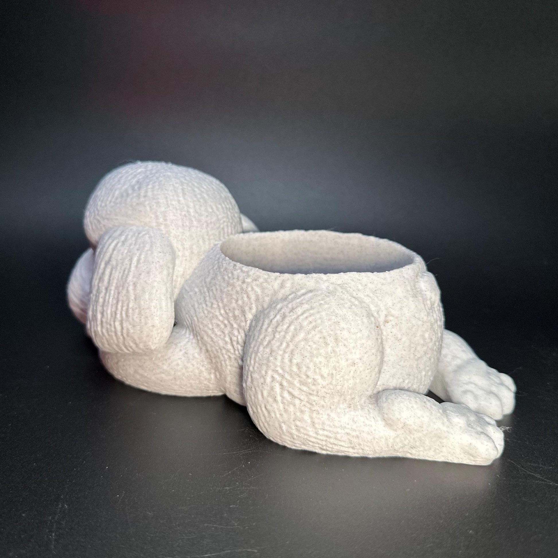 Cute 3D-printed poodle planter for succulents or small plants. Available in six colors: black, chocolate brown, beige, white, gray, and marble.