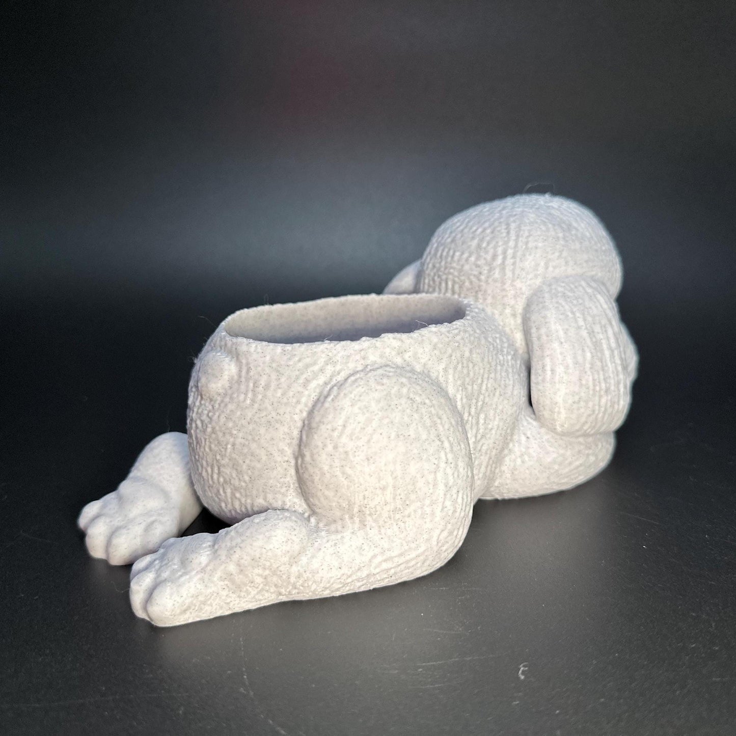 Cute 3D-printed poodle planter for succulents or small plants. Available in six colors: black, chocolate brown, beige, white, gray, and marble.
