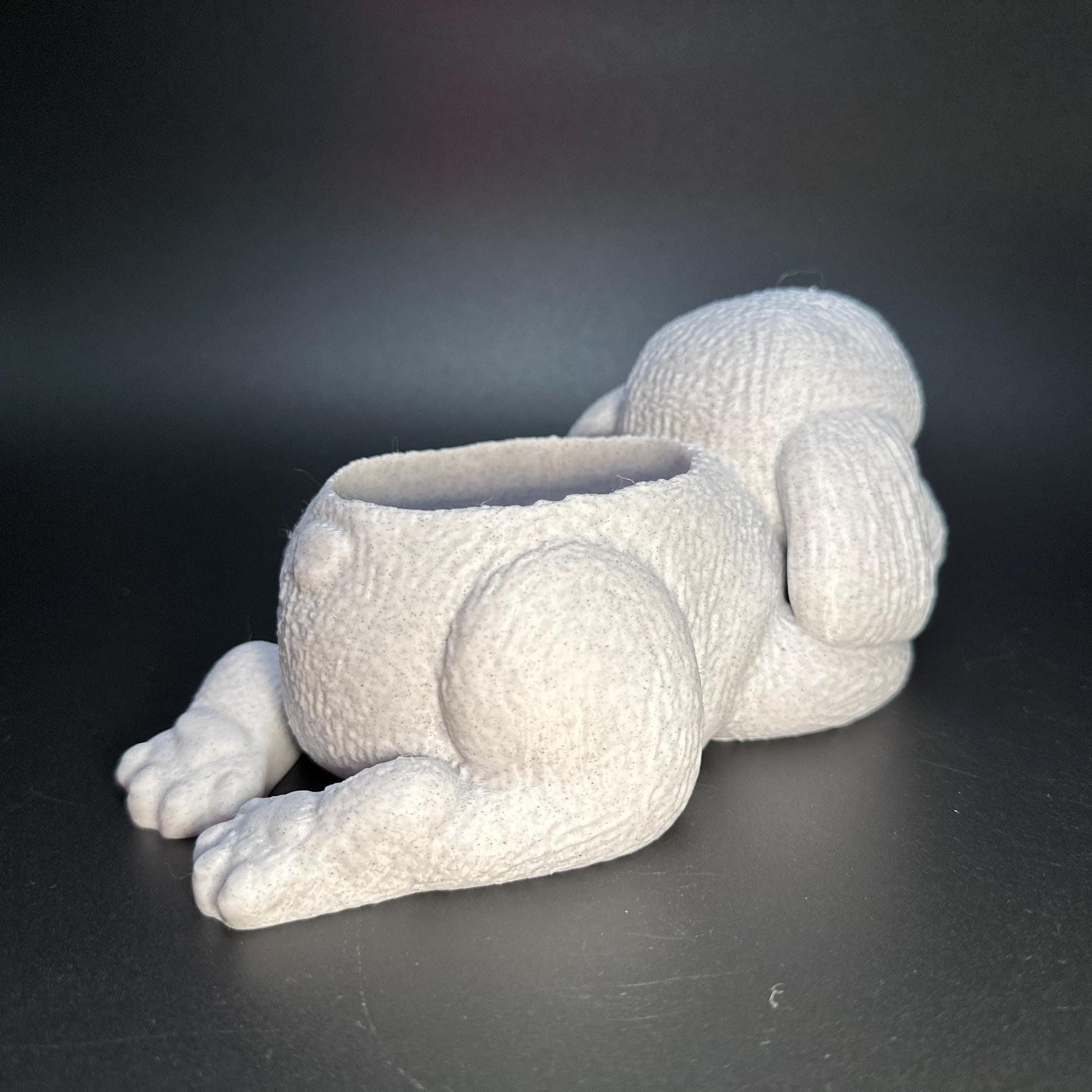Cute 3D-printed poodle planter for succulents or small plants. Available in six colors: black, chocolate brown, beige, white, gray, and marble.